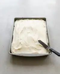 Whisking real pumpkin puree and sugar for a moist Pumpkin Spice Cake batter