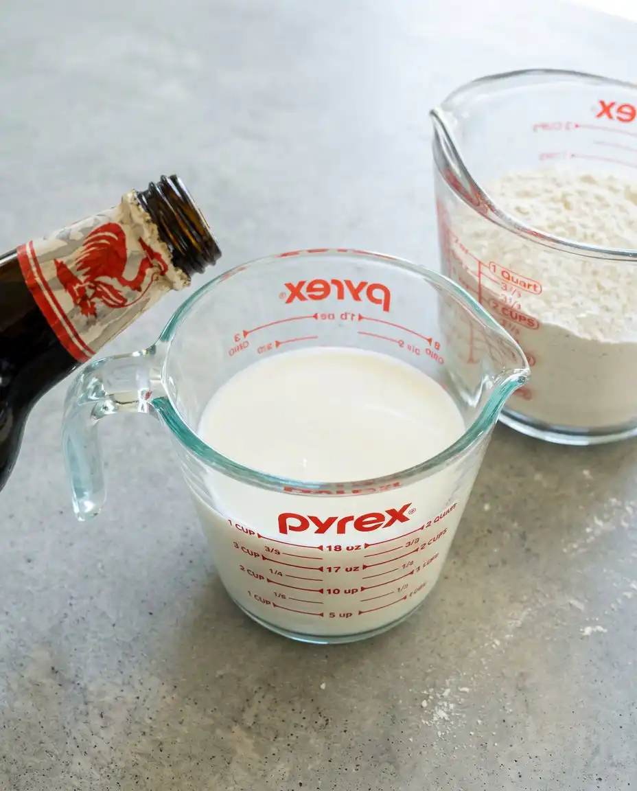 Pantry ingredients including pancake mix and powdered sugar for making a 3-Ingredient Funnel Cake.