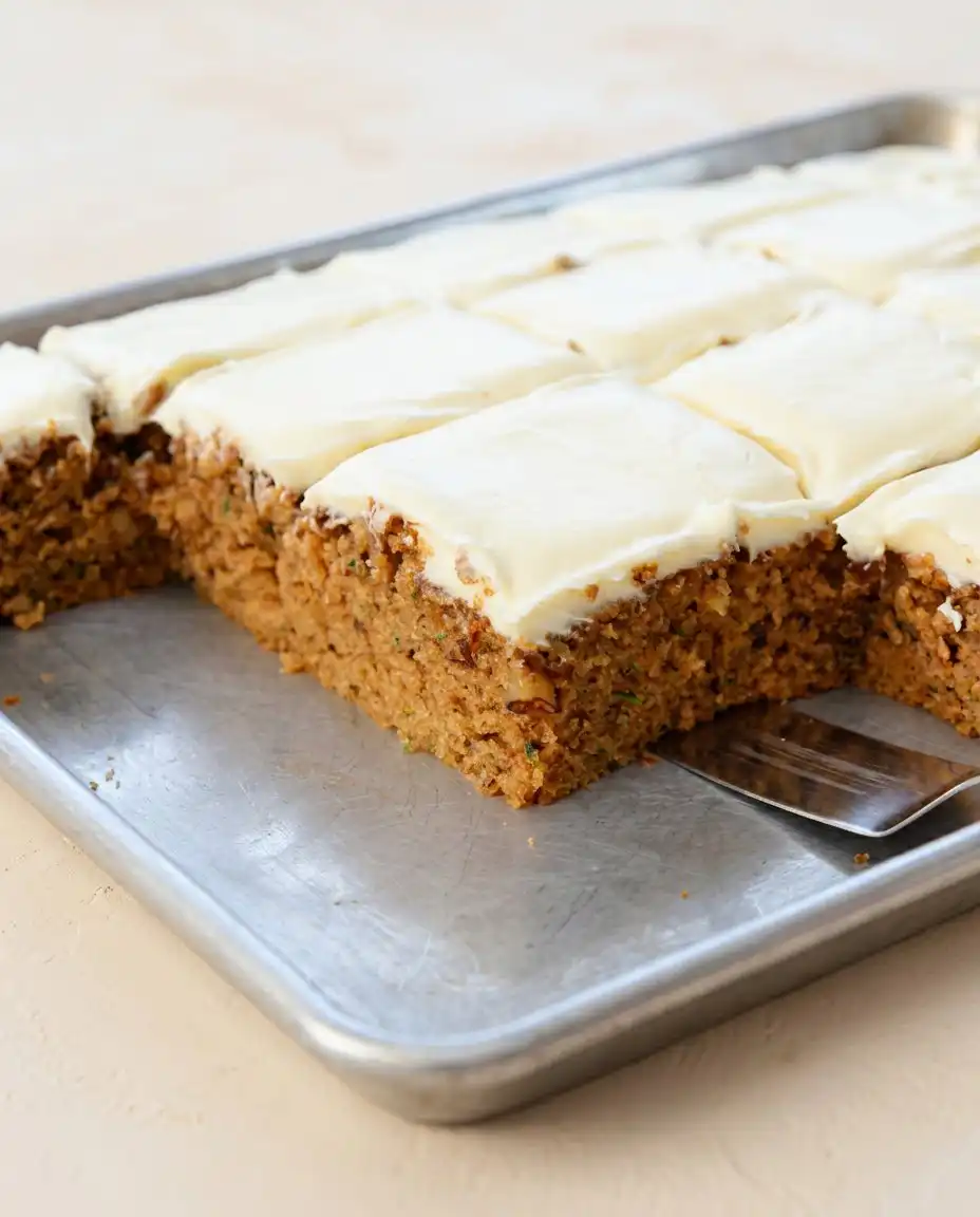 Zucchini Spice Cake 16 A perfect single slice of Zucchini Spice Cake served on a plate next to a cup of hot black coffee.
