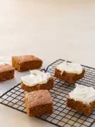 Two Ingredient Pumpkin Spice Cake cooling on a rustic wire rack in a warm vintage kitchen
