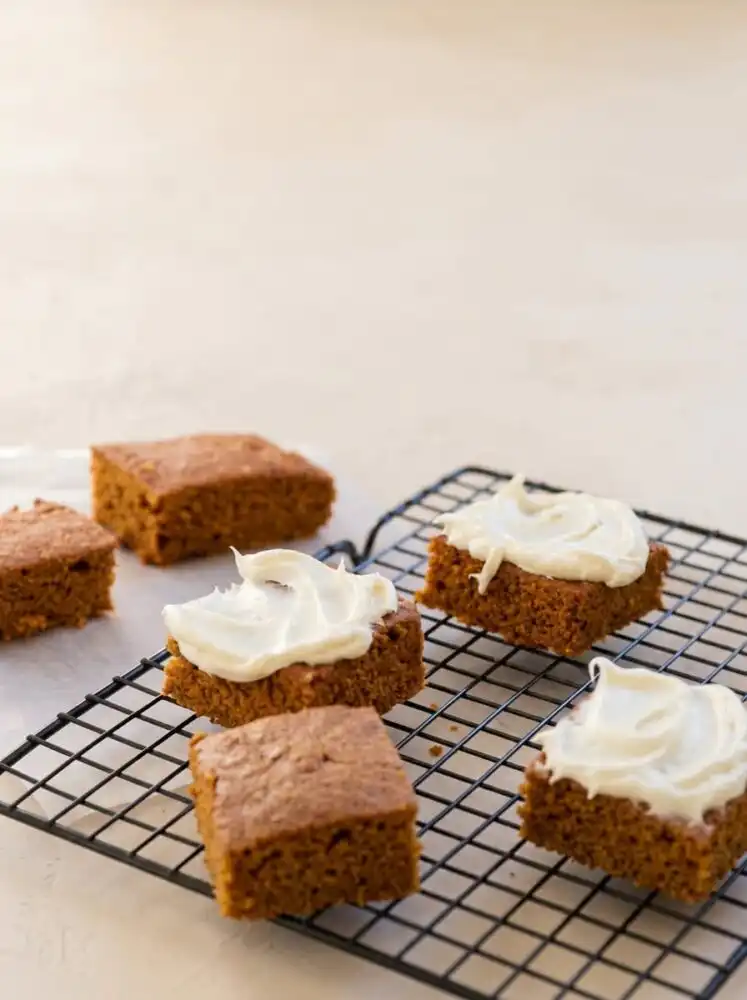 Home - Cake Half - Small Batch Baking & Cupcakes 7 Two Ingredient Pumpkin Spice Cake cooling on a rustic wire rack in a warm vintage kitchen