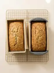 An elegant zucchini cake with Greek yogurt sliced on a marble counter