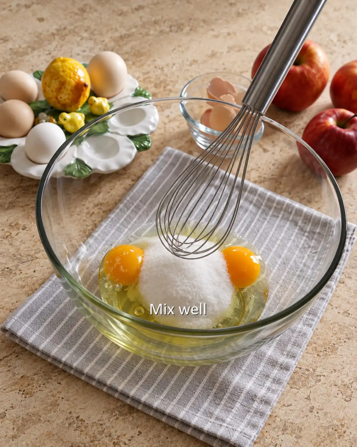 Folding sliced tart fruit into bowl batter for an easy apple cake with fresh apples evenly.